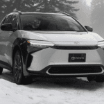 silver electric Toyota vehicle in snow